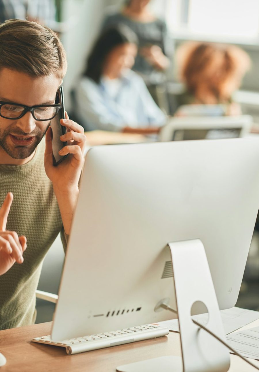 Patient call-center operator gesturing during a phone-call